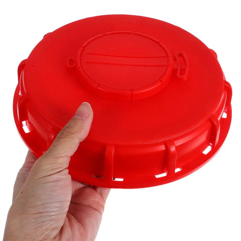 Two Pack Red Abs Ibc Tank Inlet Cover Lids With Breathable Vent And Valve Cap Providing Tight Seal For Safe Ibc Tote Water Storage And Transport Without Leaks held in hand