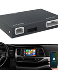 Toyota Wireless CarPlay And Android Auto Adapter Upgrades Your Ride With Entune Two Point Zero Touch Two Retrofit Kit For 2014 To 2019 Models Works With Tundra Highlander RAV4 Tacoma Camry Corolla Avalon Prius CHR Sienna And More, shown installed in car dashboard with smartphone interface.