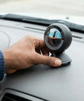 Straight Up Dead On Digital Slope Meter And Vehicle Tilt Gauge equipped with a swiveling display on car dashboard.