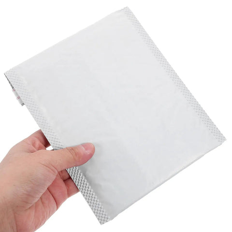 Close-up of a hand holding a white bubble mailer from the 100 Pack Bubble Envelope Mailers 15x18 Inches Plus 4cm Self Seal Waterproof Packaging Bags
