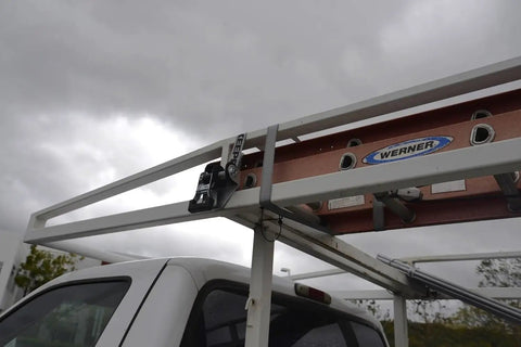 1.5 Inch By 8 Foot Mountable Rack Ratchet Tie Down Straps With 500 Lbs Working Load Limit securing ladder on truck rack