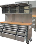 Heavy Duty 72 Inch Rolling Tool Chest With 15 Deep Drawers And Three Top Cabinets, featuring a pegboard back and lockable casters.