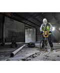 Pro 60V Brushless Breaker Hammer Kit Built As A Straight Shooter Heavy Hitter For Breaking Down Concrete And Tile With Ease in use at a job site.