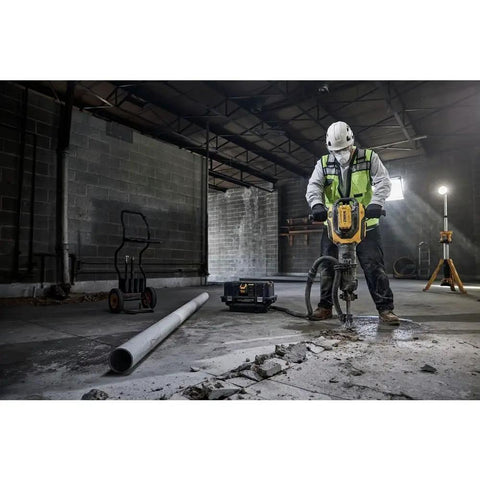 Pro 60V Brushless Breaker Hammer Kit Built As A Straight Shooter Heavy Hitter For Breaking Down Concrete And Tile With Ease in use at a job site.