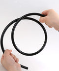 Hands holding 1/4 Inch Nylon Air Line Tubing For Pneumatic Systems, 32.8 Feet Long, 6.35mm OD, Heavy Duty High Pressure Air Hose