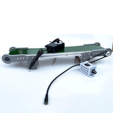 Snappy Compact Desktop Conveyor Belt With Smooth Pvc Belt And Steady 116 Rpm Drive For Zero Stress Quick Lab Friction Tests And Lightweight Workshop Moves, showing motor control and green belt.
