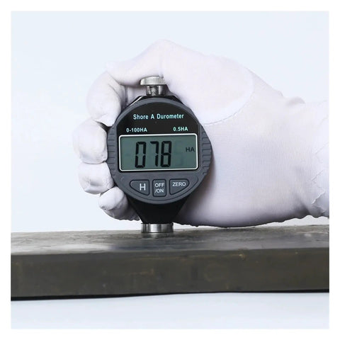 Heavy Duty Digital Durometer Hardness Tester Meter Showing Type A D C Scale Perfect For Tire Rubber Plastic Foam Shop Floor Precision Gauge Tool Delivering Straight Up Accurate Measurements Daily measuring hardness on rubber surface.
