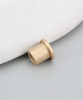 Close-up of 8 Pack Flanged Copper Sleeve Bushings 6 Mm Bore 10 Mm Outer Diameter 12 Mm Length on soft surface.