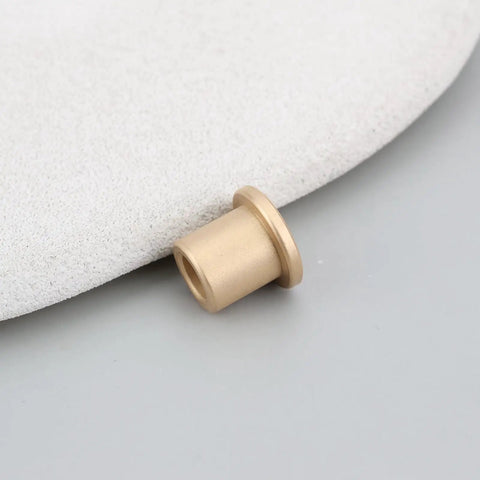 Close-up of 8 Pack Flanged Copper Sleeve Bushings 6 Mm Bore 10 Mm Outer Diameter 12 Mm Length on soft surface.