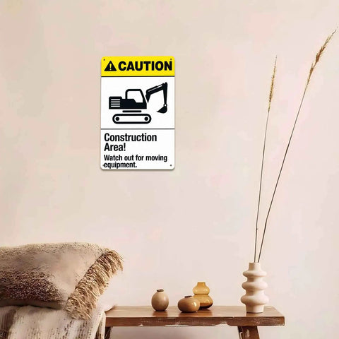 Caution Construction Area Warning Sign 8x12 Inch Aluminum displayed on wall, near vases and blanket-covered chair
