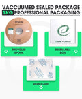 Vacuum-sealed package of 1.75mm 1kg Green PLA Filament for fast 3D printing with recycled spool, resealable box, and desiccant.