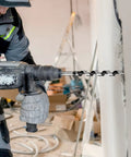 QWORK wood auger drill bit, 1/2 in dia, 16 in long, 3/8 in hex shank, mounted in cordless drill.