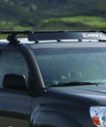 Heavy Duty Universal Roof Rack Bar Cover In Matte Black Aerodynamic Shell Provides Zero Hassle Fit And Slashes Wind Drag For Pickup Trucks On Weekend Getaways Up To 40 Inches Wide mounted on a pickup truck.