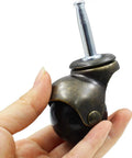 Antique Ball Caster Wheels For Furniture Smooth As Butter 1.5 Inch Diameter in hand showing dark ball and metal design.