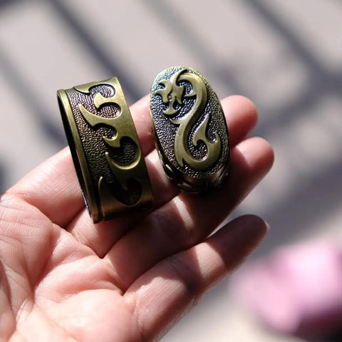 Hand holding ornate Tsuba Fuchi Kashira Menuki Set For Samurai Swords Upgrade Your Blade Setup With Alloy Guard Fits Tsuka Handle Ferrule
