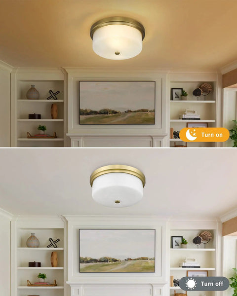 Close To Ceiling 12 Inch Flush Mount Light Fixture In Gold Metal Finish With Handmade White Marble Art Glass Shade in living room.