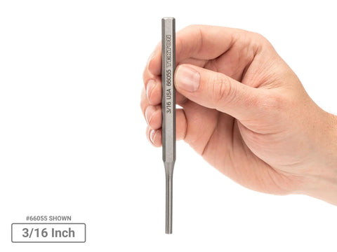 Hand holding 3/16 inch pin punch from Do It All Punch Set With Walnut Block For Metal And Woodworking, 18 Piece Kit