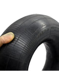 Close-up of a 19x7-8 Inner Tube With TR13 Straight Valve Stem for ATV and equipment use, held by a gloved hand.
