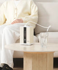 Hydrogen Inhalation Device With 99.99 Percent Purity And Separation Technology 225 mL Per Minute Dual Port Inhaler on table