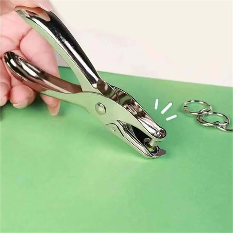 Hand using Metal Handheld Hole Puncher With 3Mm And 6Mm Circular Holes, Punches Up To 8 Sheets Of A4 Paper, Durable Steel Build