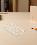 Top Shelf Acrylic Router Template Kit For Woodworking Projects Killer Butterfly Bow Tie Inlay Motif laid on a wooden workspace.