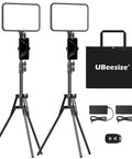 Two Pack LED Video Light Kit With 20W Ring Lights And 300 LEDs, tripod stands, phone holders, bag, and adapters visible