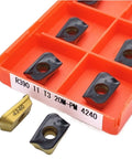 R390 11T320M-PM inserts in an orange case for Heavy Duty Indexable Carbide Lathe Tool Set 10 Piece R390 11T320M-PM Inserts For Face Turning Milling Steel And Stainless Iron Like A Boss.