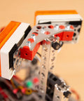 Heavy Duty Kickass Aluminum 120 Degree Robot Gusset installed on a TETRIX structure, enhancing rigidity for robots.