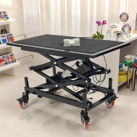 Hella Sturdy Electric Scissor Lift Table And Height Adjustable Rolling Cart With Solid 400 Pound Capacity Silent Motor in workshop setting.