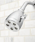 Polished silver AnyStream 360 Degree Showerhead with Uniform Water Coverage and Boosted Pressure against a tiled wall.