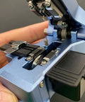 Boss Level Mt 09 Fiber Cleaver Automatic Cable Cutting Knife For Ftth Installations, showing blade and clamps in a blue housing.