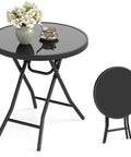 Compact Outdoor Folding Side Table With Tempered Glass Top And Heavy Duty Steel Frame For Backyard Hangouts shown with flowers and tea.