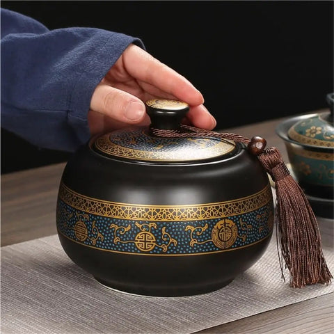 Airtight Ceramic Tea Canister With Silicone Seal Lid For Loose Leaf Coffee Beans Snacks And Nuts Keeps Kitchen Stash Crisp Locks In Flavor Premium Pantry Organizer held by hand.