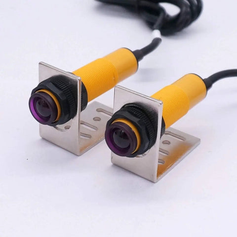 Dual M18 infrared photoelectric sensors with mounting brackets, PNP NO, DC 6-36V, 5m range, through-beam and reflective capabilities