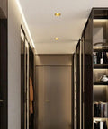 Set Of Eight Slick Dimmable LED Recessed Downlights With Zero Shine Trouble And Solid Brass Housing Offering Quick Flush Mount Setup in modern hallway.