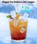 Self Cleaning Countertop Ice Maker Slams Out Bullet Ice In Six Minutes Whisper Quiet Operation Keeping Your Kitchen Vibes On Deck And Your Cooler Loaded For Weekend Hangouts Without Breaking The Bank. Ice cubes floating in drink with orange and mint.