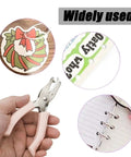 Hand holding Two Pack Mini Circle Hole Punches One Quarter Inch And One Eighth Inch for crafts, scrapbooking, and card making.