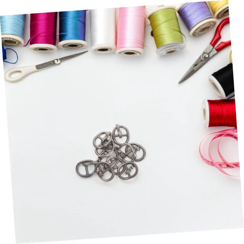 Handy Mini Buckle Sewing Kit 150 Piece Set for Doll Clothes and DIY Craft Projects on a crafting table with tools and threads.