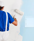 QWORK 10x10 inch plastic drywall access panel side view on blue wall beside painter applying white paint