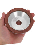Top Tier Cup Shaped Diamond Grinding Wheel 100mm held in hand for stone metal and concrete sharpening tasks.