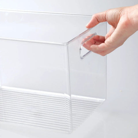 Hand holding deep plastic storage bin with built-in handles for cube shelving in office, closet, cabinet, bedroom, bathroom, nursery or dorm.