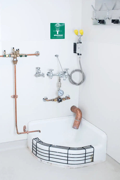 Commander Wall Mount Service Sink Faucet With 8-Inch Centers, Rough Chrome Finish, visible over a utility sink.