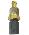 Engine coolant temperature sensor with brass threaded body and gray plastic connector, close-up view