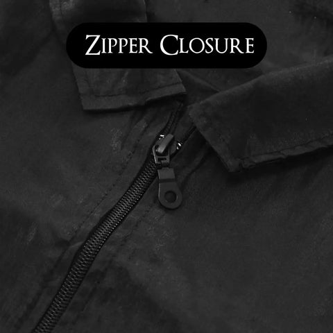 Close-up of zipper closure on Sleek Black Barber Jacket With Zippered Front And Contrast Pockets XL Nylon Short Sleeve Top.