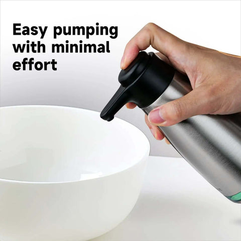Person using Stainless Steel Liquid Soap Dispenser 15 Fl Oz For Dish And Hand Soap No Fuss Pump Top Lifts Off For Easy Refill near bowl