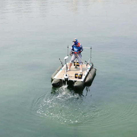 Quiet Riot 12V Bow Mount Trolling Motor 55 Lb Thrust 48 Inch Shaft Wireless Remote Control on a fishing raft in calm waters.