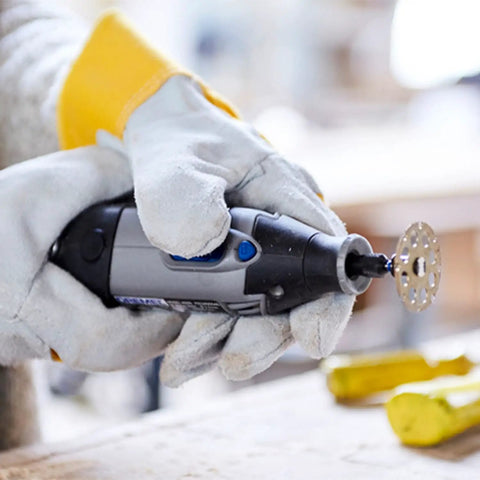 Person using rotary tool with 1-1/2 Inch EZ Lock Cutting Wheel For Wood And Laminate Fiberglass And Plastic Fast Cuts On Soft And Hardwood.