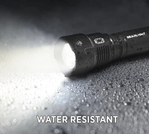 High Powered LED Flashlight S1200 mid size zoomable beam water resistant handheld light for camping, outdoor adventures, showing water resistance