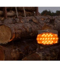 Logger Lite Safety Kit For Trucks And Logging Crews Amber Beacon With 26 LEDs on logs illuminated at dusk