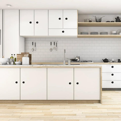 Modern kitchen with white cabinets featuring Black Round Cabinet Knobs Set Of 50 Pieces, 1.2 Inch Diameter, installed with 1 inch screws.
